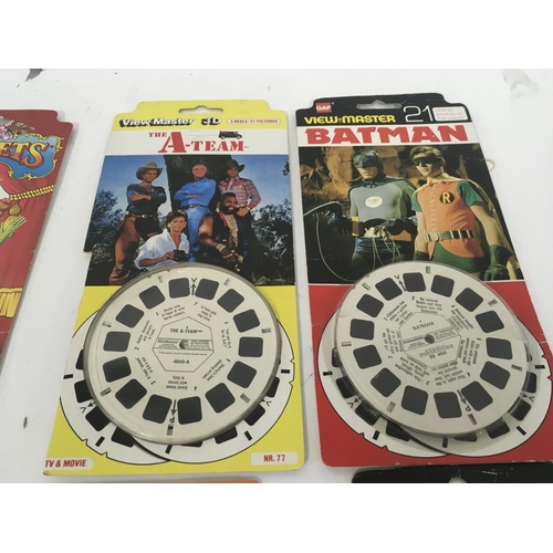 884 - A GAF Viemaster in red plus 7 carded reel sets including Sooty..Muppets..A team..Batman..ET..My litt... 