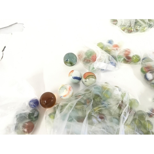 891 - A collection of assorted types of marbles with varying ages and sizes.