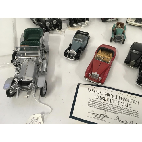 894 - A collection of 11Collectable model cars by Franklin Mint. Corgi and others