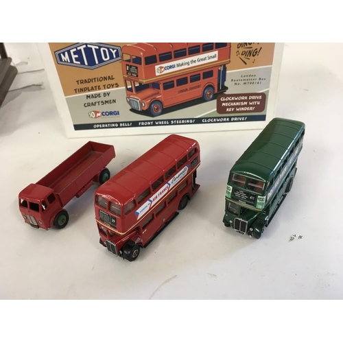 897 - A collection of four model vehicles. Includes a Minic Toys Routemaster with key