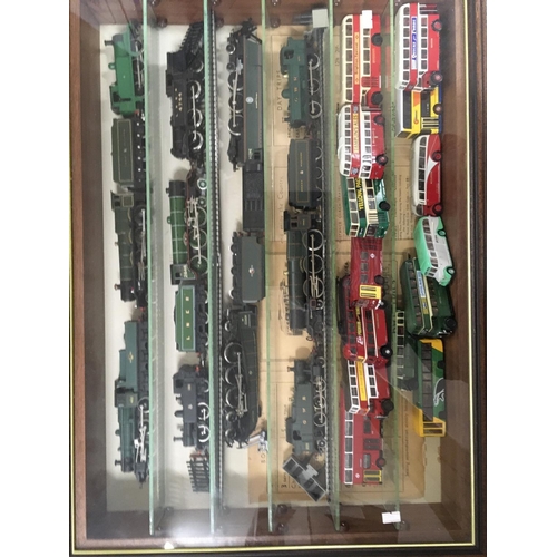 901 - A presentation case containing 11 model railway trains 6 with tenders and 14 buses.