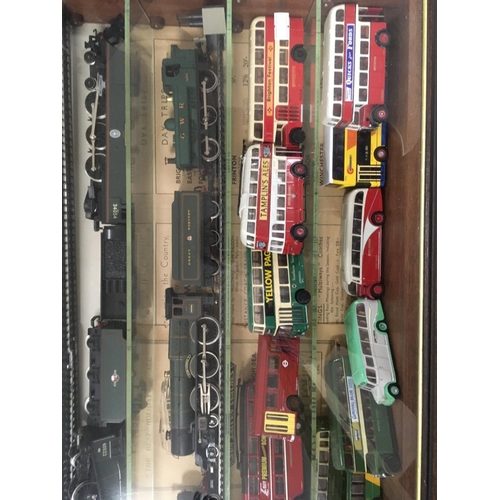 901 - A presentation case containing 11 model railway trains 6 with tenders and 14 buses.