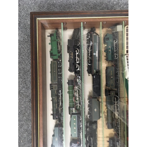 901 - A presentation case containing 11 model railway trains 6 with tenders and 14 buses.