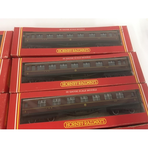 911 - A collection of 10 boxed Hornby model Railway coaches. 00 gauge.