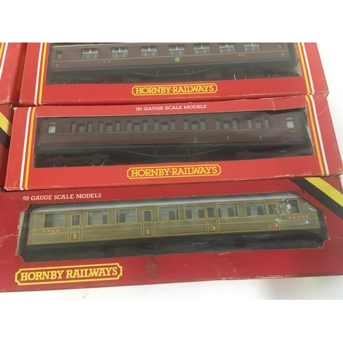 911 - A collection of 10 boxed Hornby model Railway coaches. 00 gauge.