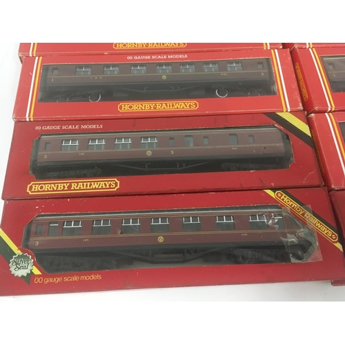 911 - A collection of 10 boxed Hornby model Railway coaches. 00 gauge.