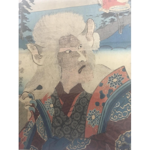 111 - A Japanese Kunisada woodblock print depicting The Cat Lady, wtuih later frame.