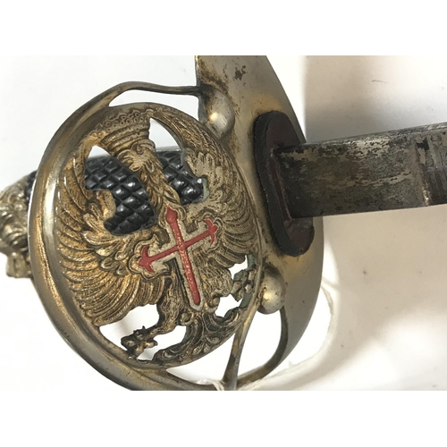 129 - An interesting Prussian court sword with lion head pommel enamelled crest and etched blade. No scabb... 