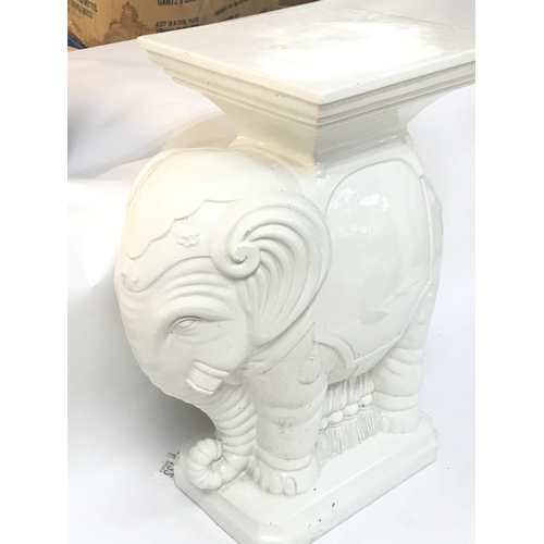 149 - A porcelain elephant pedestal,48.5cm tall. Postage category D