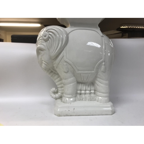 149 - A porcelain elephant pedestal,48.5cm tall. Postage category D
