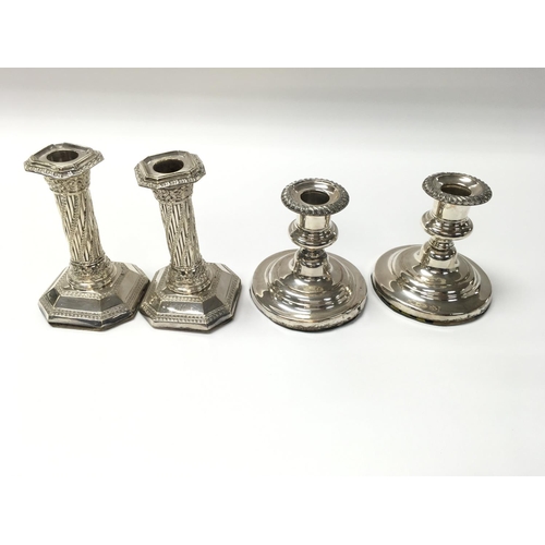 16 - Two pairs of silver plated candle sticks. (B)