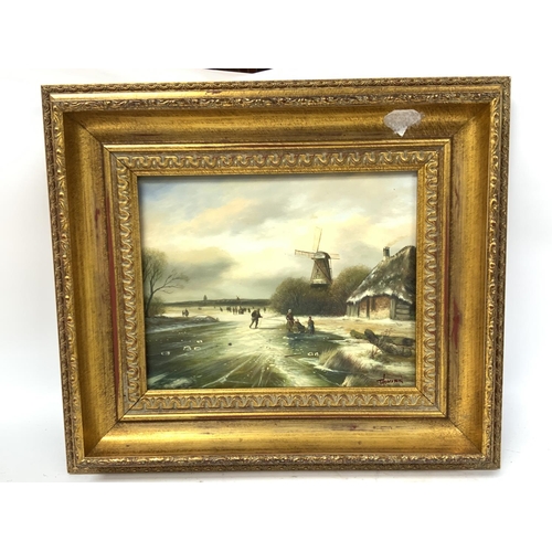 187 - A gilt framed oil on board of a Dutch winter scene, approx 40cm x 34.5cm.