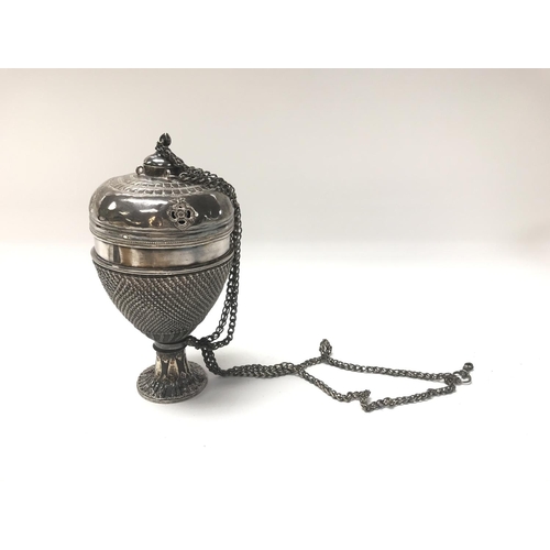 26 - A white metal incense burner with engraved buddhist symbols. 21cm.