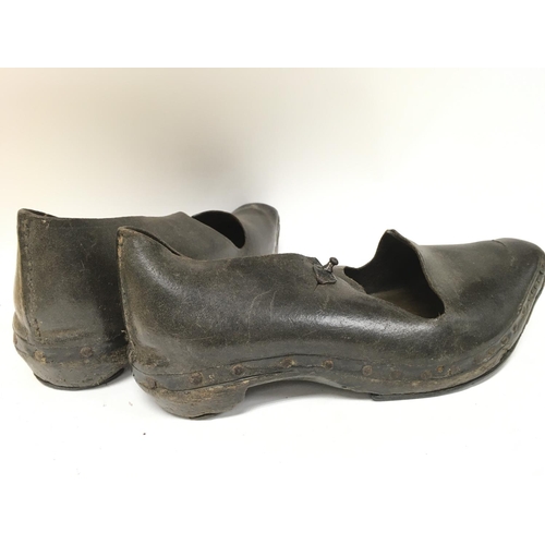 267 - A pair of old leather shoes , postage category B