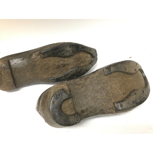 267 - A pair of old leather shoes , postage category B