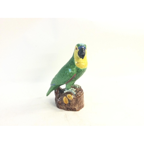 272 - Porcelain parrot statue. Plinth also porcelain.  No reserve.