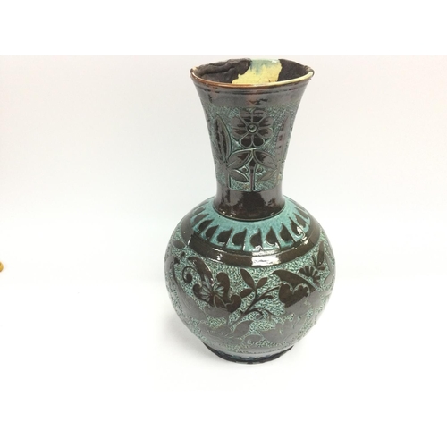 298 - A C H Brannam vase. 34cm high.