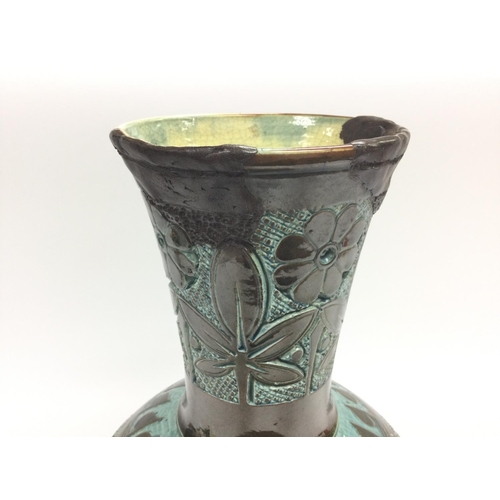 298 - A C H Brannam vase. 34cm high.