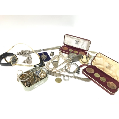 308 - A Collection of costume jewellery including Hallmarked silver knife and fork with engraved designs, ... 