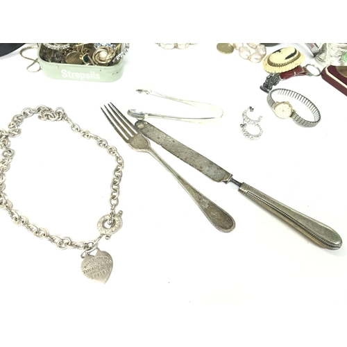 308 - A Collection of costume jewellery including Hallmarked silver knife and fork with engraved designs, ... 