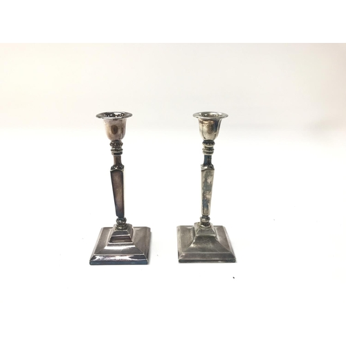 35 - Pair of silver plated candlesticks.