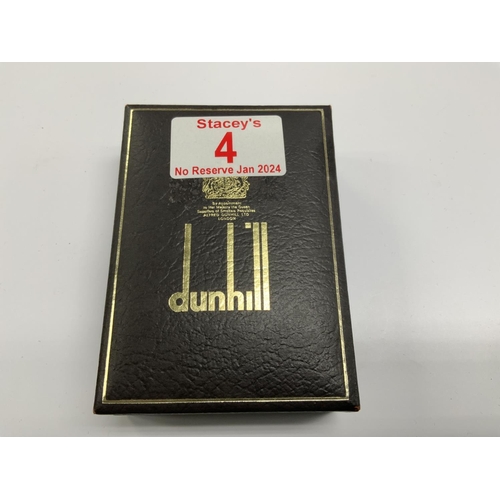 4 - A boxed vintage gilt metal Dunhill lighter. (A)