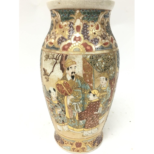 476 - A Japanese satsuma vase decorated with oriental figures. 23.5cm tall. Postage category D