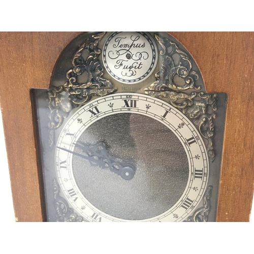 478 - A bracket timepiece clock by Rotherham Of Coventry. Dimensions 10x14x22cm