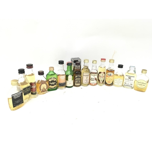 496 - A Collection of miniature whiskeys including Glenfiddich, Chivas Regal, Cluny, White & Mackay etc