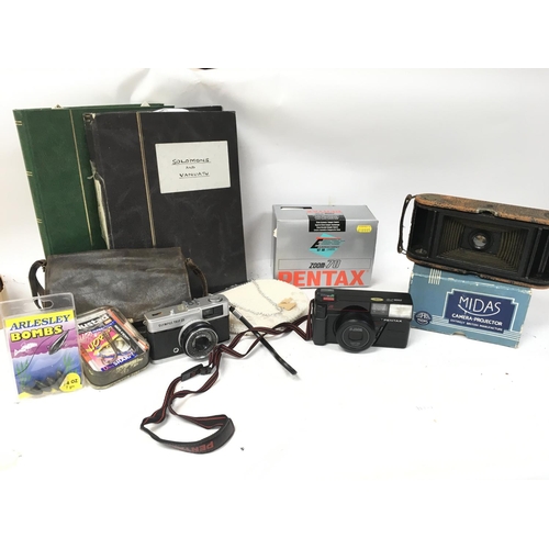 501 - A Collection of items including games Zoom-70, Olympus Trip 35, fishing tackle, stamp collection