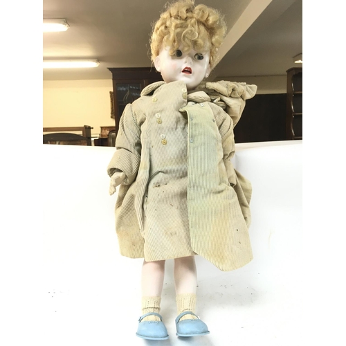 525 - A vintage Pedigree doll, 70cm tall. postage category D