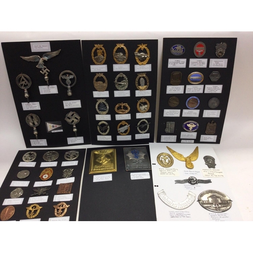 577 - An album containing retrospective German Third Reich badges and car pendants. Mounted on card.