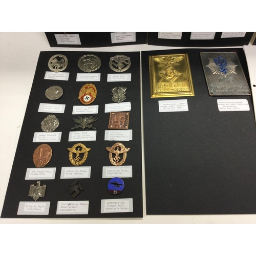 577 - An album containing retrospective German Third Reich badges and car pendants. Mounted on card.