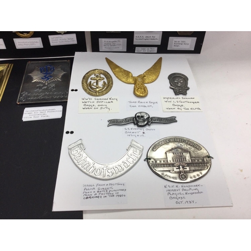 577 - An album containing retrospective German Third Reich badges and car pendants. Mounted on card.