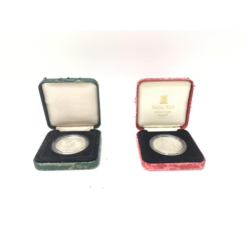 61 - Two cased sterling silver coins. (A)