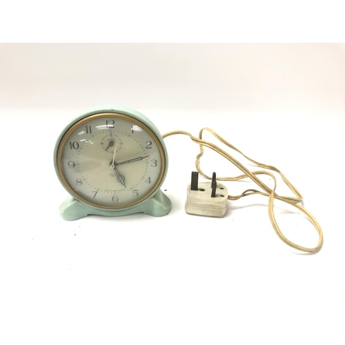 67 - A SMITHS electric aqua plastic electric table alarm clock.