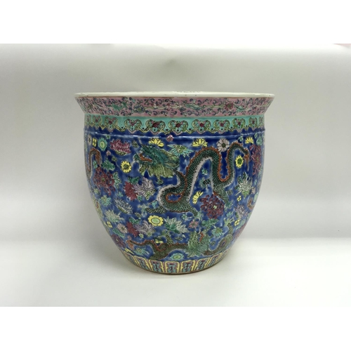 94 - A well decorated 20th century Cantonese jardiniere with dragon decoration.