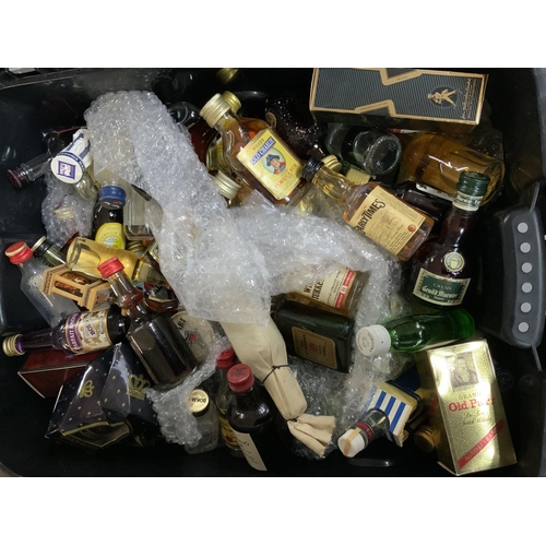 98 - A box of alcohol miniatures to include some whisky examples.