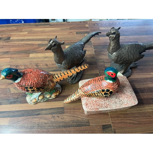 101 - A collection of various pheasant figurines