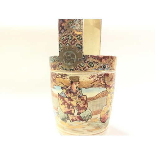 1002 - A Japanese satsuma bucket vase, decorated with figures. 31.5cm tall approximately. Postage category ... 