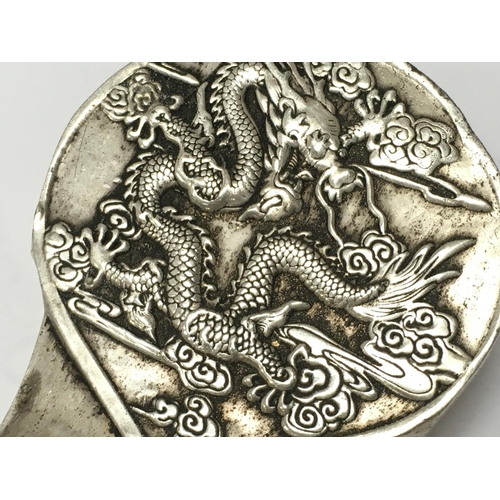 1007 - A Chinese metal cash. decorated with dragons and Fenghuang. Postage category B