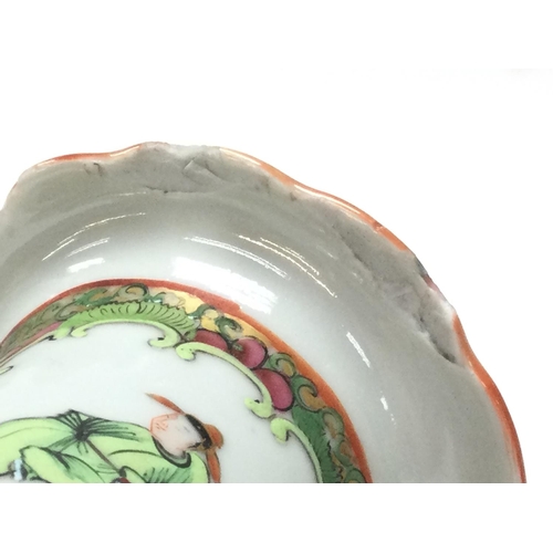 1015 - A Cantonese Famille Rose tea pot and vase. Chips at the rim of the vase and at the base. Approximate... 