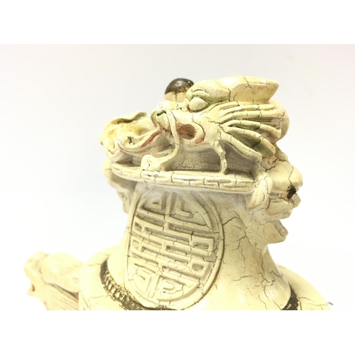 1016 - A Chinese dragon incense burner , 21cm tall. Postage category D