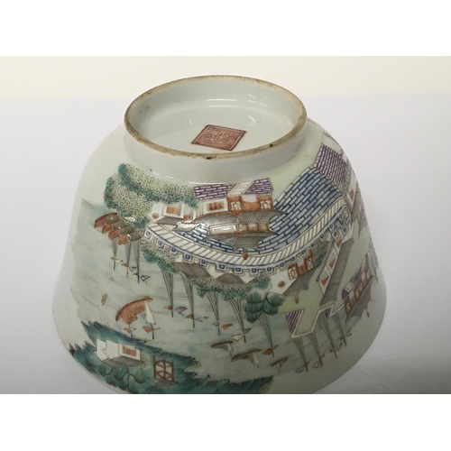 1037 - A Chinese Export Porcelain famille Vert bowl decorated with a harbour view buildings hand painted ca... 