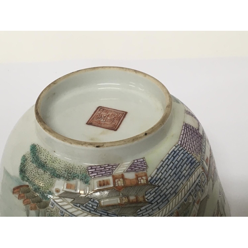 1037 - A Chinese Export Porcelain famille Vert bowl decorated with a harbour view buildings hand painted ca... 