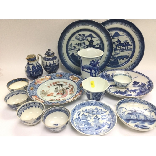 1046 - A collection of blue and white Oriental ceramics comprising plates, vases and bowls. Shipping catego... 