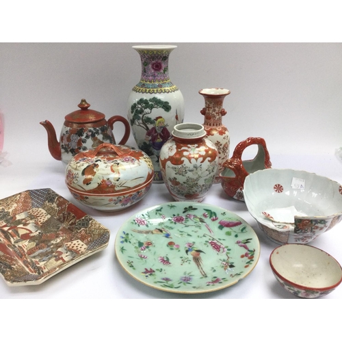 1049 - A box of Oriental ceramics including a teapot, vases and dishes. Shipping category D.