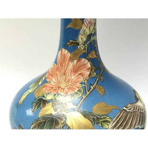 1057 - Oriental vases decorated with cherry blossom and birds , 23.5cm tall. No obvious damage or restorati... 