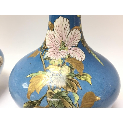 1057 - Oriental vases decorated with cherry blossom and birds , 23.5cm tall. No obvious damage or restorati... 