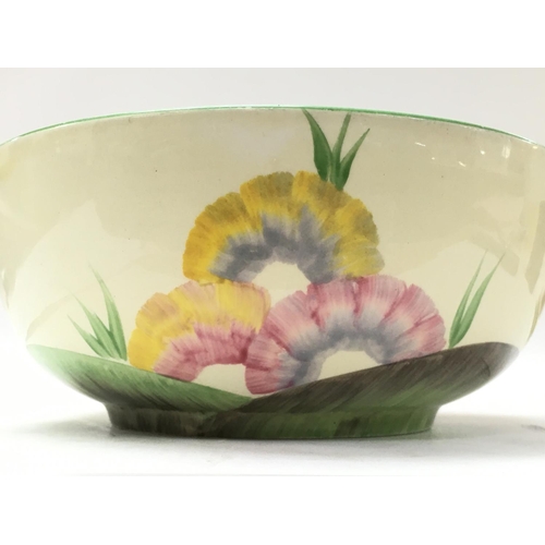 1130 - A Clarice Cliff Honeyglaze bowl, 19.5cm approximately in diameter. postage category D